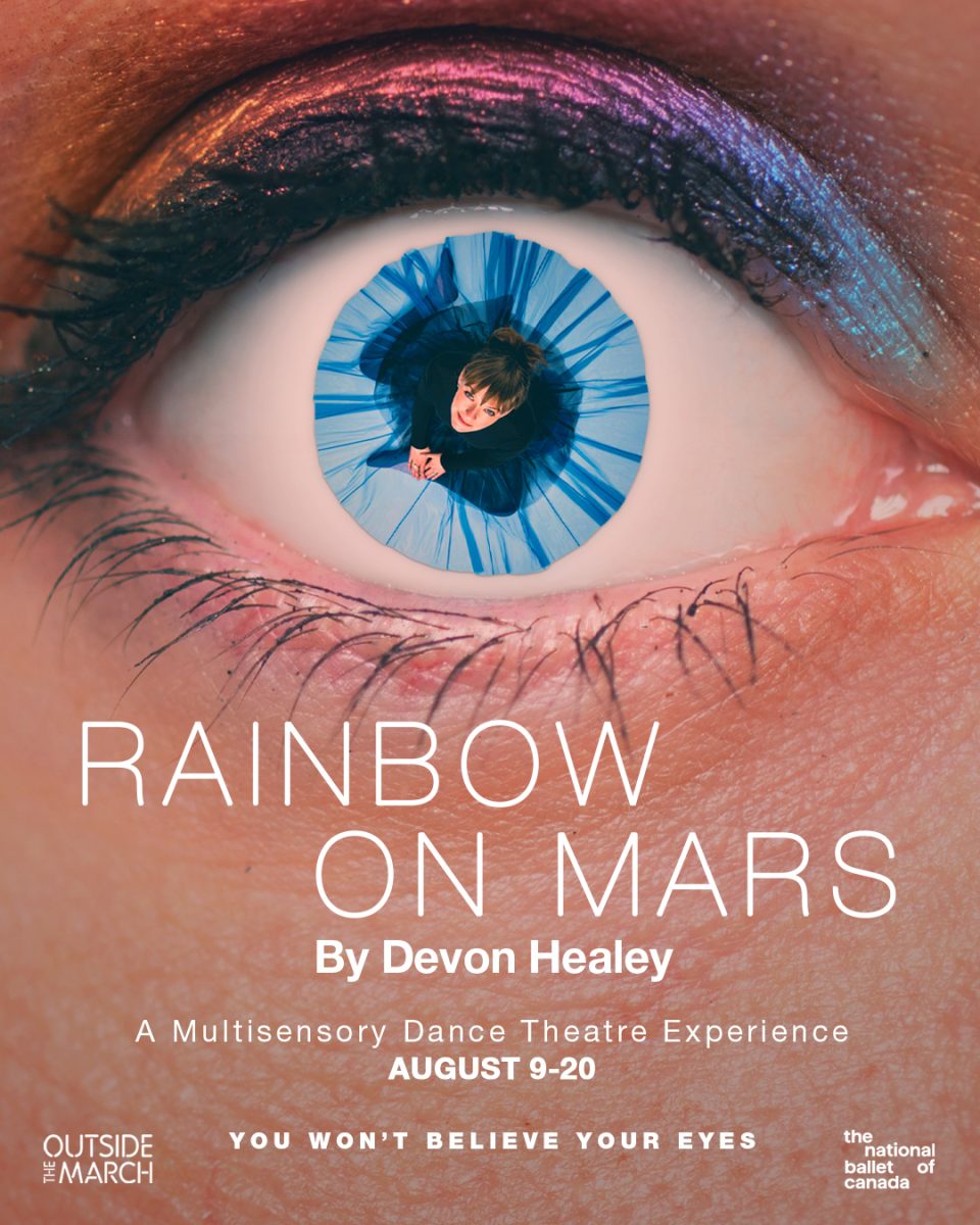 The poster image is a closeup photograph of a human eye looking directly at the camera. A sense of wonder emanates. The eye is framed by black eyelashes against white skin. On the upper eyelid, along the lash line, runs a sleek black line of makeup and above it, rainbow-coloured eyeshadow. The iris of the eye is blue. But wait: the blue of the iris is not an iris, it’s a blue skirt! Upon closer inspection we see a white woman sitting in the centre of the eye. She is in her mid-thirties, dressed in a long-sleeved black body suit and tight black pants with a deep blue long tulle skirt, flowing from her waist and spread out over her legs, pulled into a circle. She, at first blush, looks like a blue circular iris but, upon further inspection, emerges as the iris or, is it the other way around? At the centre of the pupil, as though we’re looking from above, is her face staring directly at us. Her deep brown hair is swept up into a high bun atop her head with brown bangs dusting the top of her brown eyebrows. Her look and smile, more of a smirk, radiates a devilish-intrigue.